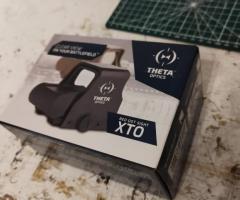 Mira de punto rojo Theta Optics modelo XTO. Diseñada para una visión clara en el campo de batalla.